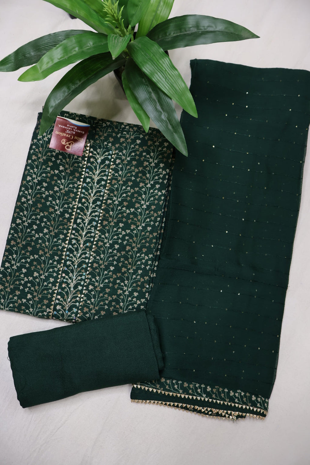 Bottle Green Muslin Printed Unstitched Suit Set With Chiffon Sequins Worked Dupatta The Banarasee Aura