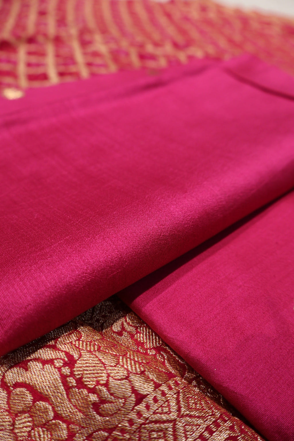 Rani Pink Pure Banarasi Chiniyal Silk Unstitched Suit Set With Pure Khadi Georgette Bandhej Dupatta The Banarasee Aura
